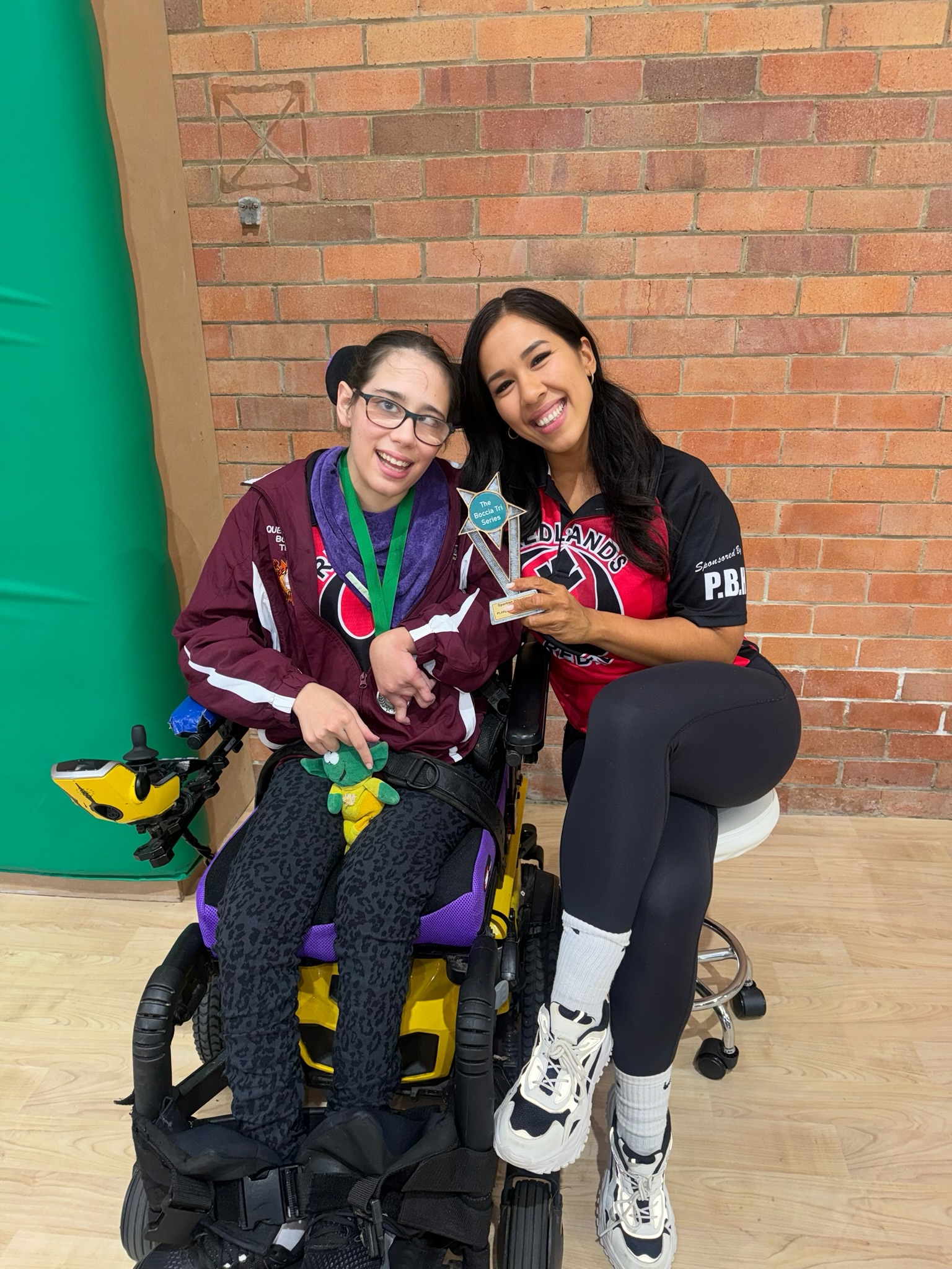 A Redlands Rebel with a Boccia Tri Series trophy