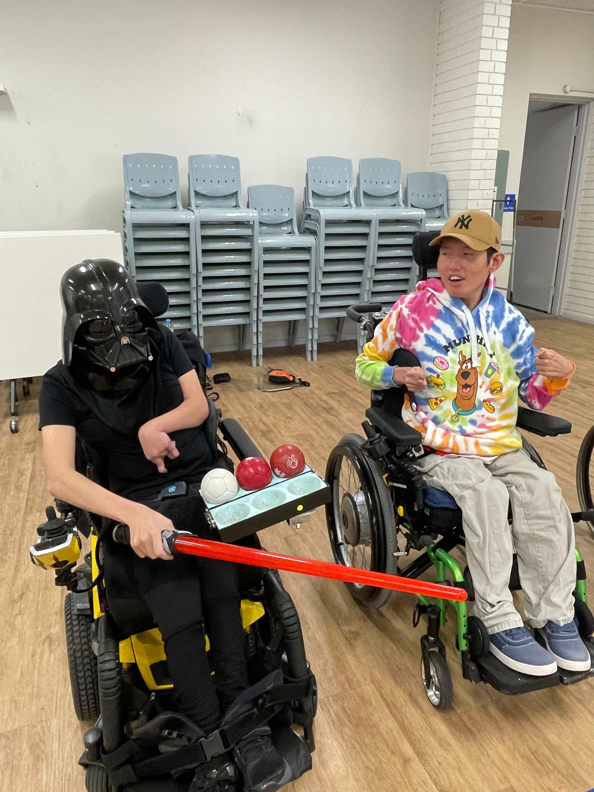 Theme night in the hall with a lightsaber and a Scooby hoodie