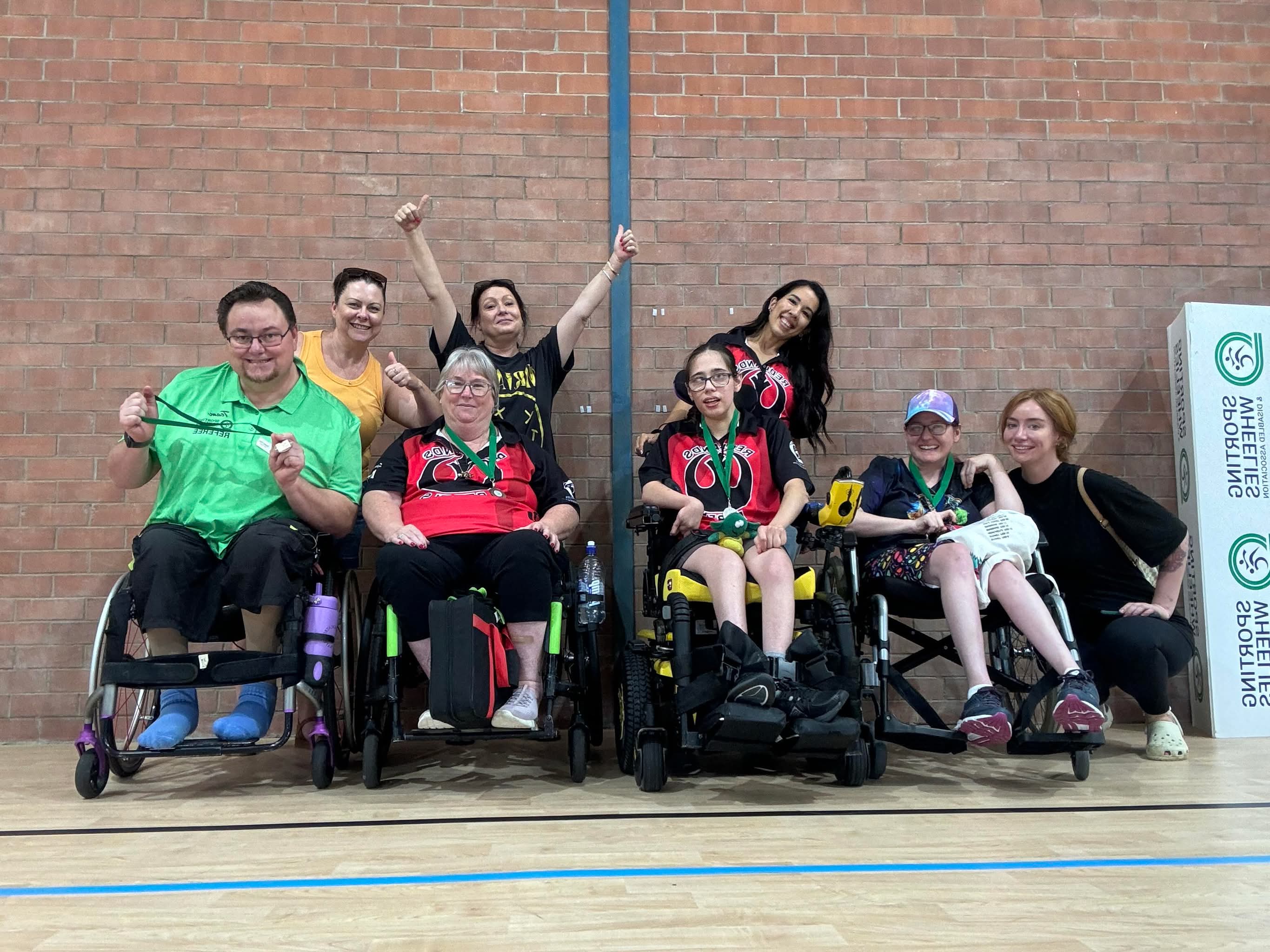 Club members wearing medals after a tournament